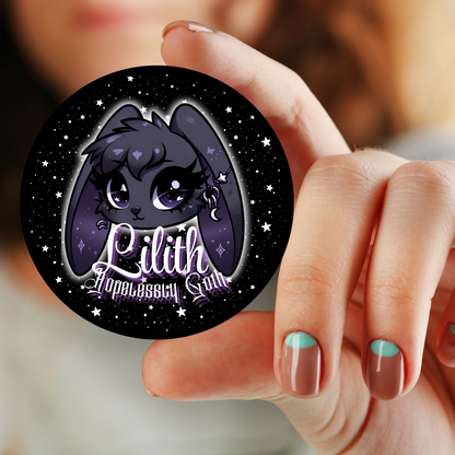 A collection of 1.25-inch and 2.25-inch button pins featuring Lilith, the goth bunny, with the slogan "Hopelessly Goth" from the Grimm & Friends Goth Collection.